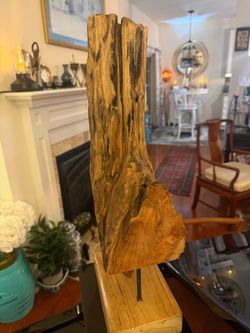 Beautiful and unique natural wood sculpture made in Indonesia. This approximately 20 inch tall piece features a free form design that showcases the na