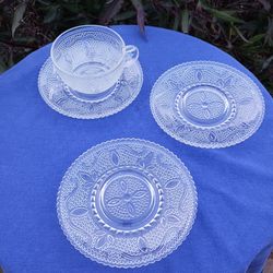 CUP AND 3 SAUCERS WITH A BEADED DESIGN