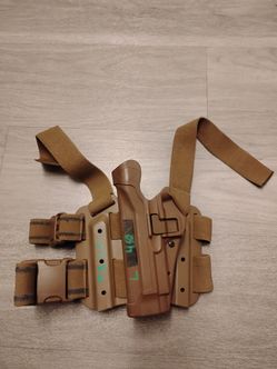 Left handed pistol leg holster
