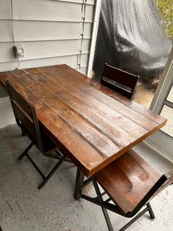 Wood table with three chairs