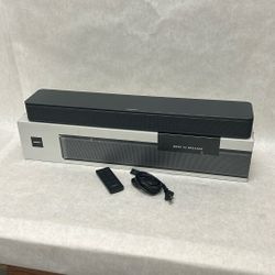 Bose TV speaker sound bar like new never hooked up with remote cord and original box