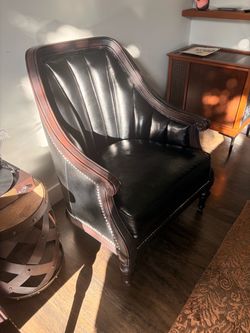 Black leather and wooden chairs