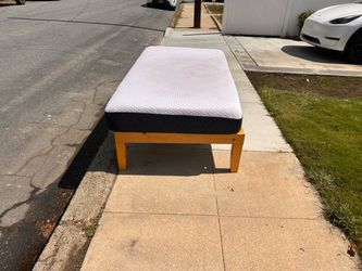 TWIN BED mattress and frame.