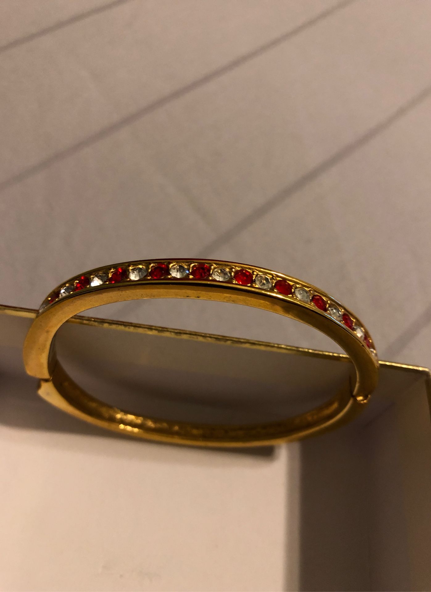 Gold plated bangle bracelet with beautiful stone detail