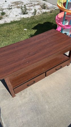 Coffee table with lift top and drawers