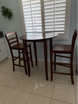 Brown bar  table and stools