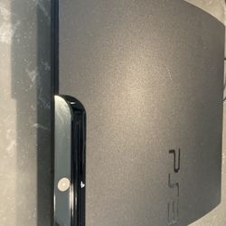 PS3 Slim With 14 Games And 2 Controllers, Charging Stand