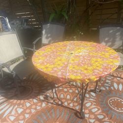 Three chairs and I have a metal table or a glass with iron stand