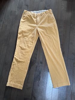Polo Ralph Lauren Corduroy Pants Yellow Size 36x34. There is visible wear and thinning of the corduroy fabric in the crotch area.