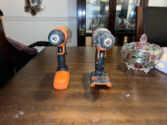 Two Black + Decker Drills