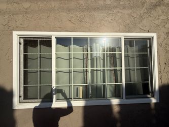 95” x 48” window with interior wooden blinds