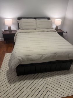 Full size black bed with new mattress