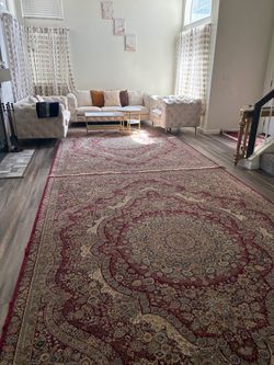Large Red Persian-Style Area Rug with sofa set and curtains