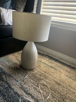 Really. ottoman and a set of Kirkland’s white and beige lamps