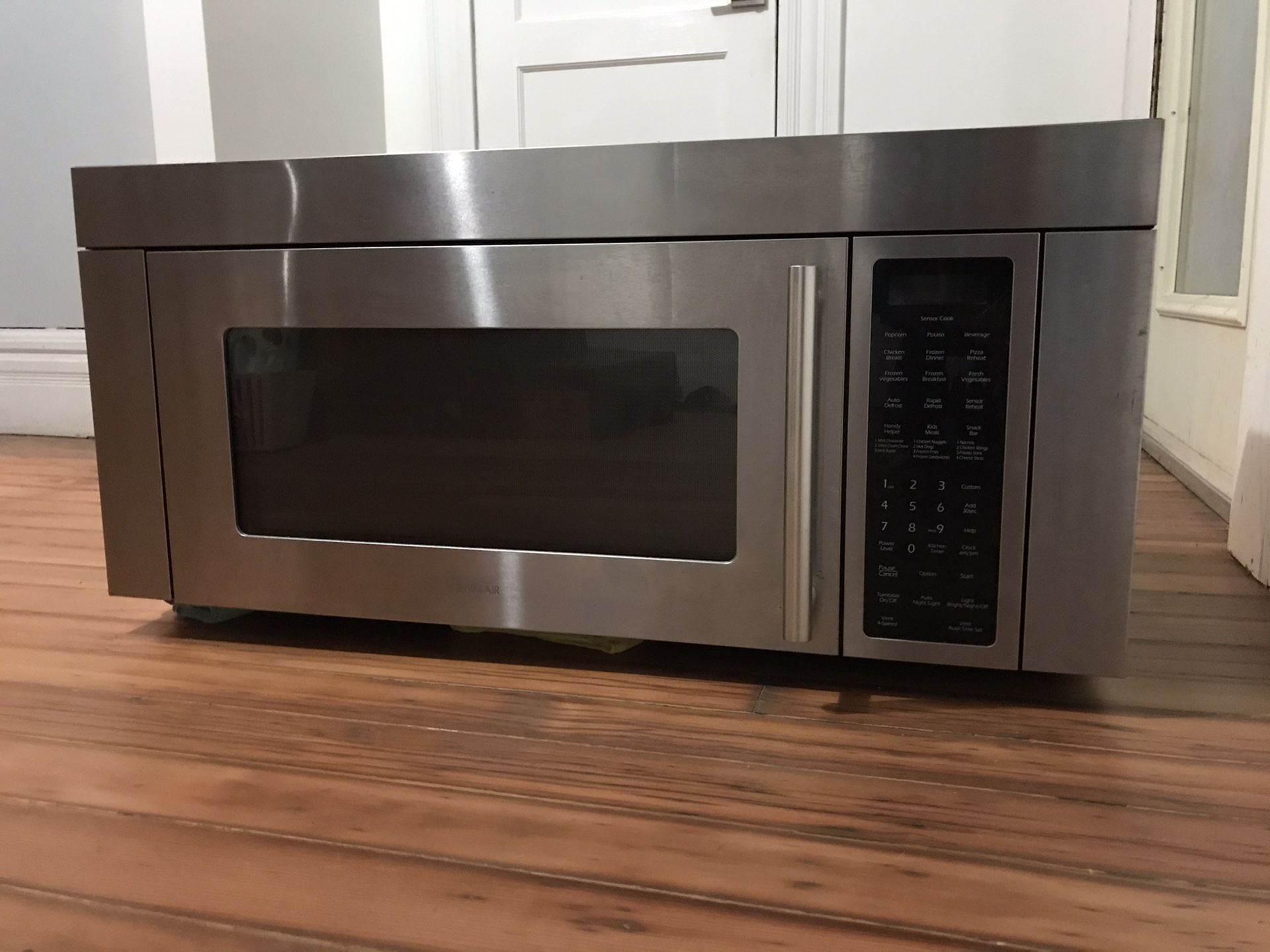 FREE 36” wide stainless steel, over range microwave oven