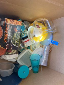 Large box of kitchen items including Starbucks glasses and Tupperware
