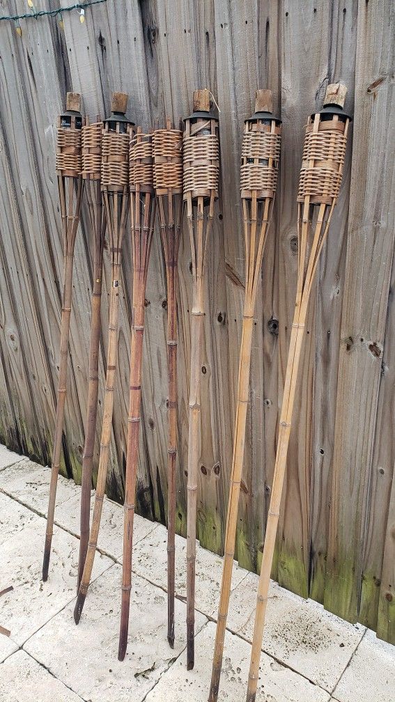 Tiki Torches 8. And 5 With Cans. Fall Cleanout Shed