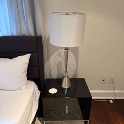 Pair of black lacquer nightstands with silver legs