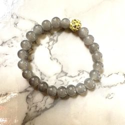 Grey Beaded Bracelet With Yellow Rhinestone Bead 