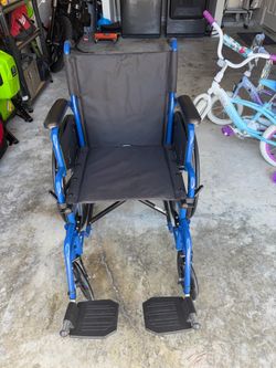 Blue Folding Wheelchair with Footrests