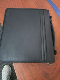 The Avenues America zip portfolio/padfolio Binder Organizer is a stylish and functional office supply designed for professionals on the go. With its b