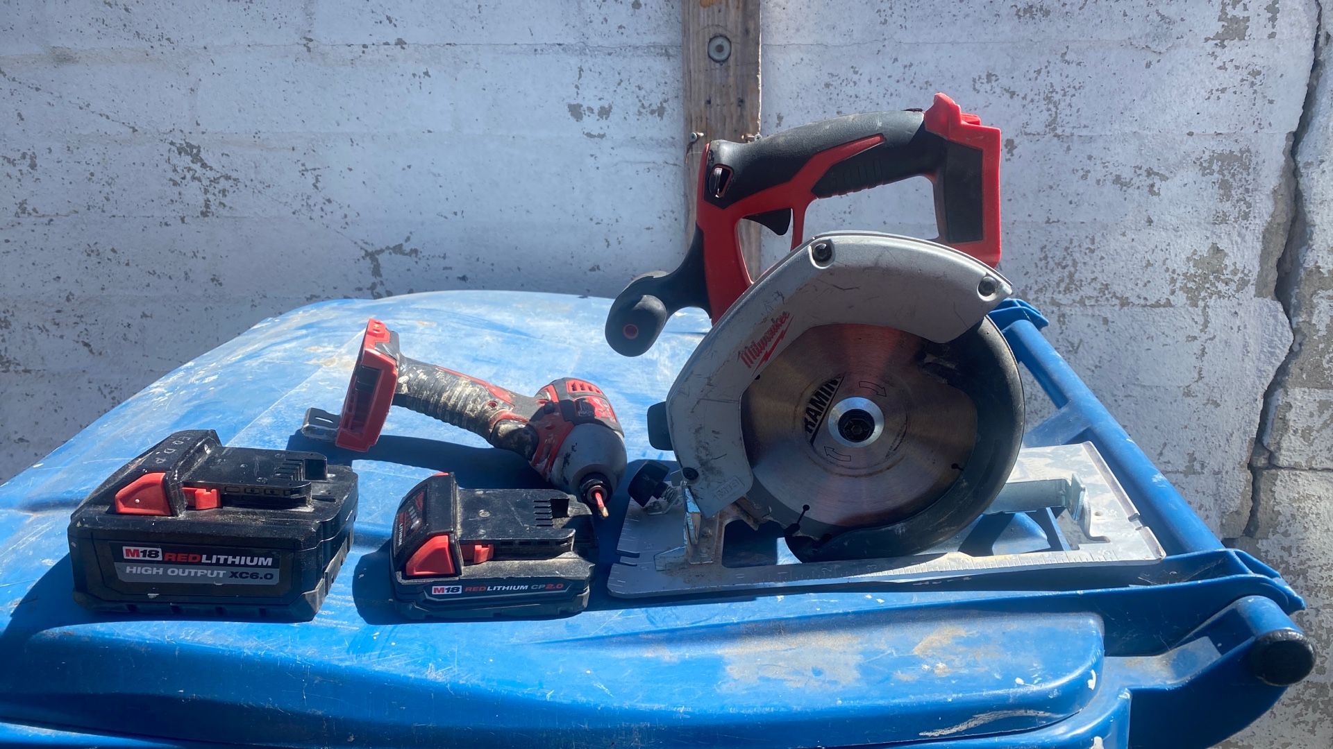 Milwaukee Impact And Skilsaw With 6.0 And 2.0 Battery