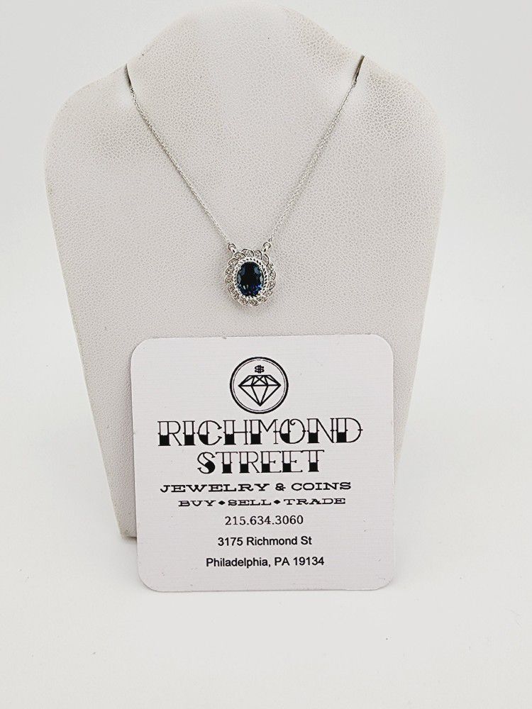 10k white gold 16"-18" chain with diamond and london blue topaz pendant