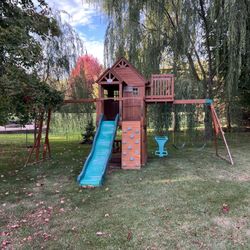 Backyard Discovery Skyfort Cedar Wood Swing Set with Wave Slide, Clubhouse, Crow's Nest, and Monkey Bars
