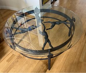 Sculptural cast iron coffee table with brand new glass top