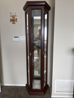 2 lighted wood curio cabinets