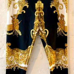 Authentic Versace leggings with classic black and gold Medusa/Baroque print.