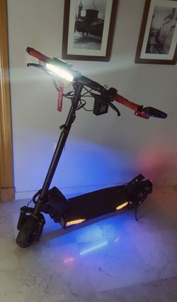 Clean Electric Scooter with LED Lights – Strong Battery, Buy & Ride!