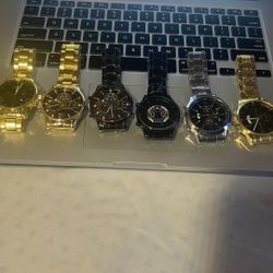 7 watches — all brand new, still wrapped in plastic and with the original protective lock in place.