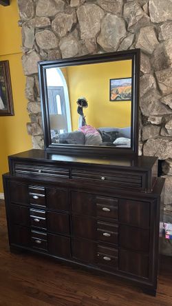 Dark brown dresser with mirror