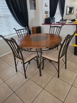 Table and chairs with iron accents