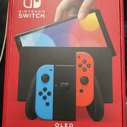  Nintendo Switch – OLED Model w/ Neon Red & Neon Blue