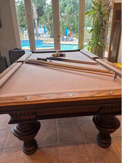 Slate billiard table with accessories.