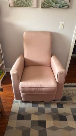 Reclining swivel armchair, great for nursing and calming a baby