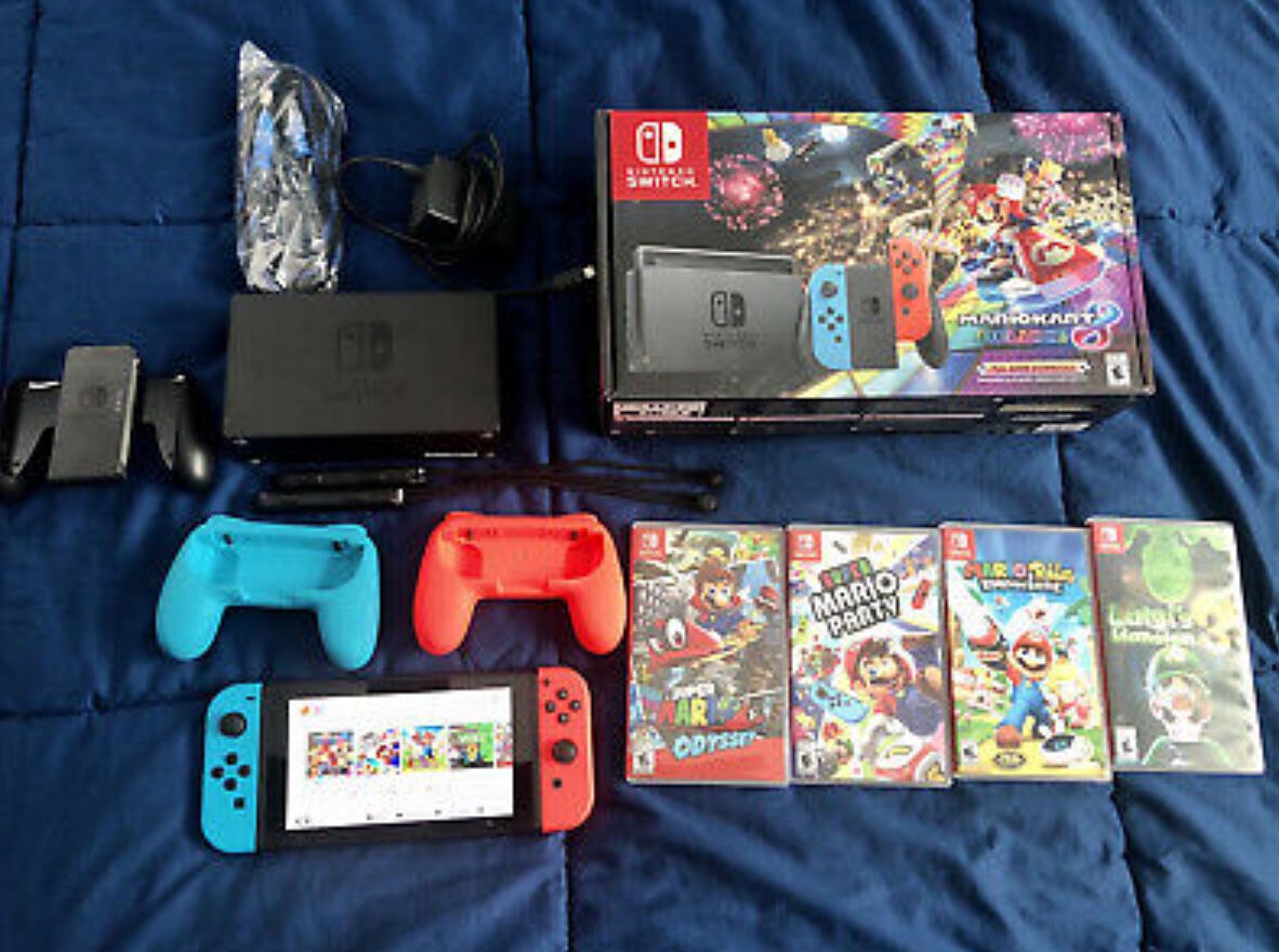Nintendo Switch with Blue and Red Controllers and Mario Kart 8 Bundle 5 Games. Call or6465836089Text me.