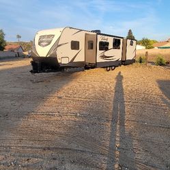 travel trailer with HUGE BUNKHOUSE & OUTDOOR KITCHEN. VERY SPACIOUS & CLEAN