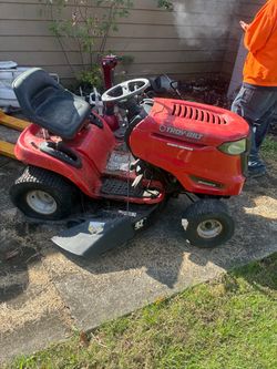Troy built mower ( starts in starting fluid and moves)