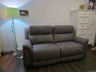 Ashley power reclining sofa in excellent condition punctureless fabric