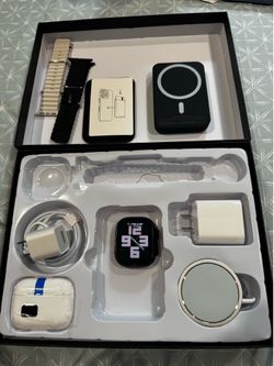 Apple Watch, AirPods, MagSafe, wallet, and charger