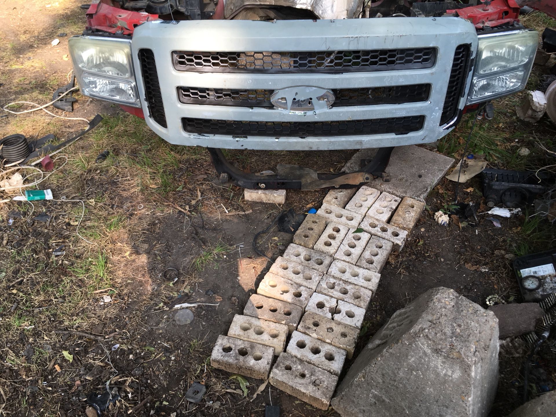 FRONT GRILL, BOTH HEADLIGHTS, & RADIATOR SUPPORT FOR A F-350 TRUCK
