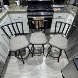 Set of 3 Swivel Counter Stools – 24” Height – Black Metal w/ Gray Cushions
