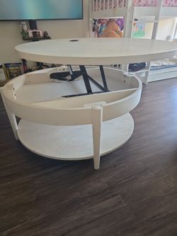 36" wide round wood lift-top Coffee Table - shelf