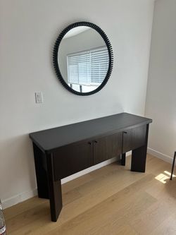 CB2 Kara Mann Shadow Blackened Wood Sideboard & CB2 Monaco Black Round Mirror