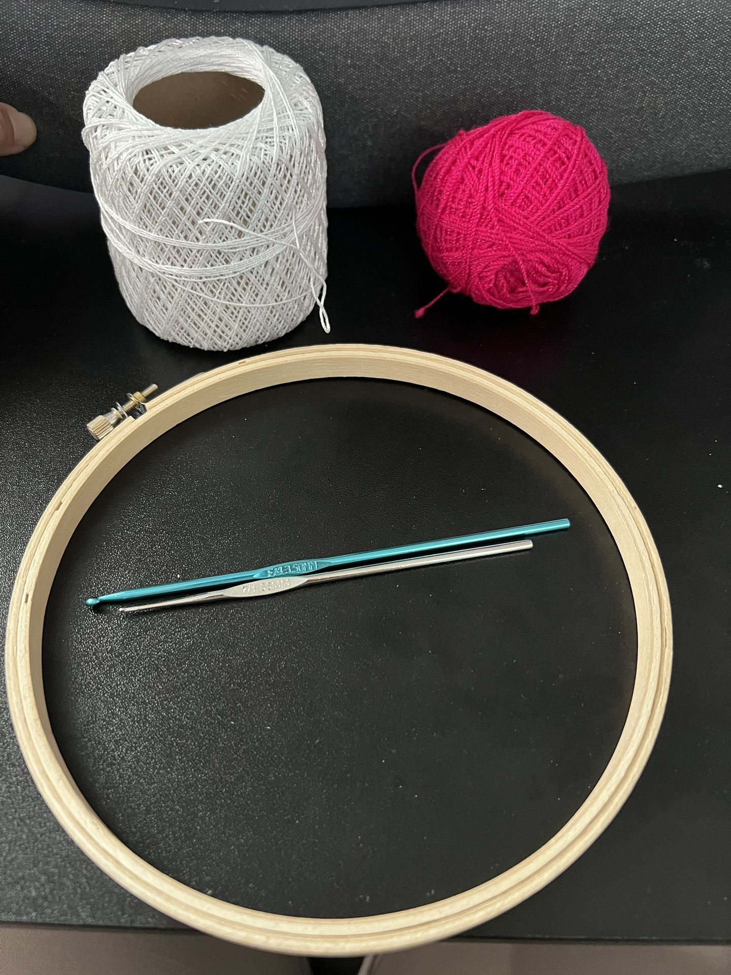 Embroidery Circle With Two Crochet Hooks And Some Yarn