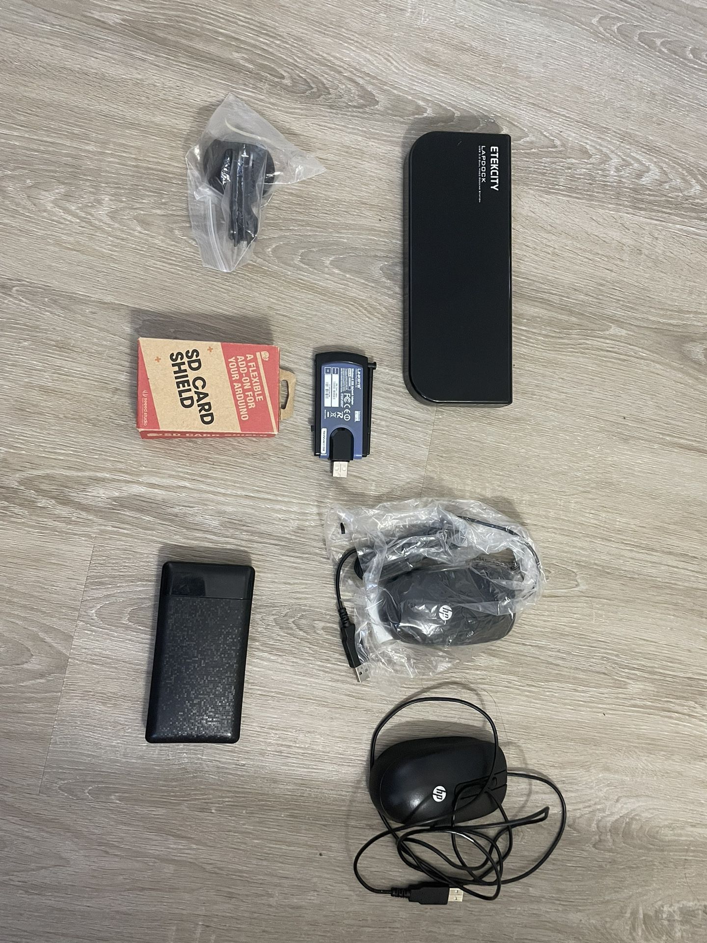 2 Hp mouse, Eteckcity , Lap dock, Linksys Wireless-n USB Network Adapter, SD Card Shield, Holder And Power Bank.