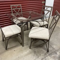 Glass top table with 4 chairs